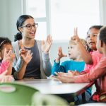 teacher and kids playing games in calssroom