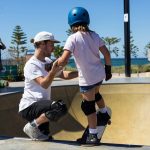 girl with skateboard safety gear