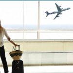 Woman on the airport looking through the window