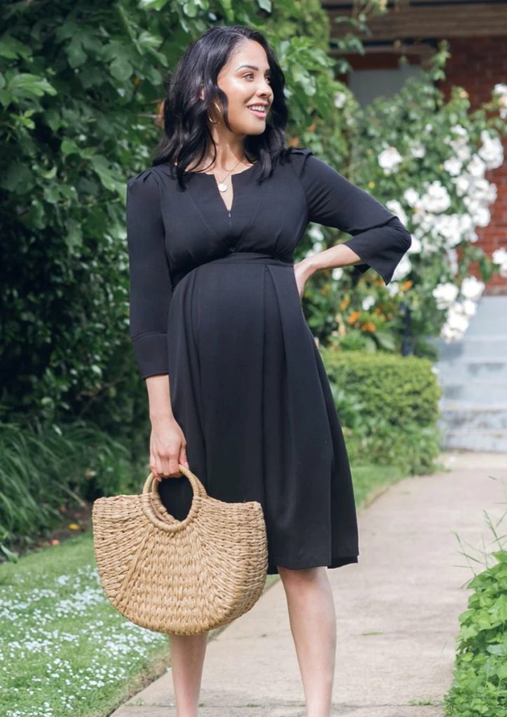 pregnant woman wearing black party maternity dress