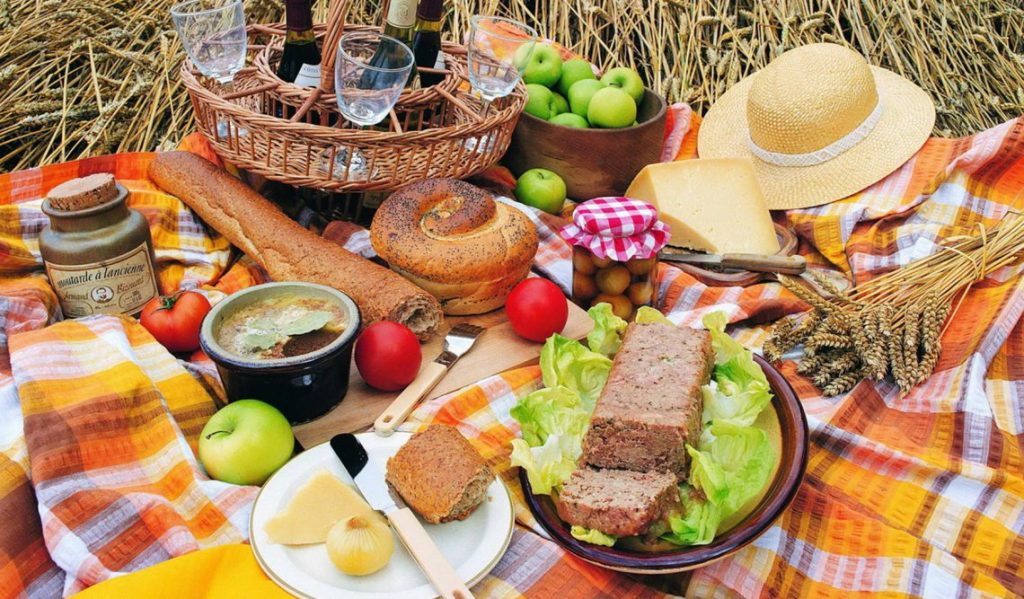 food and drinks on picnic blanket