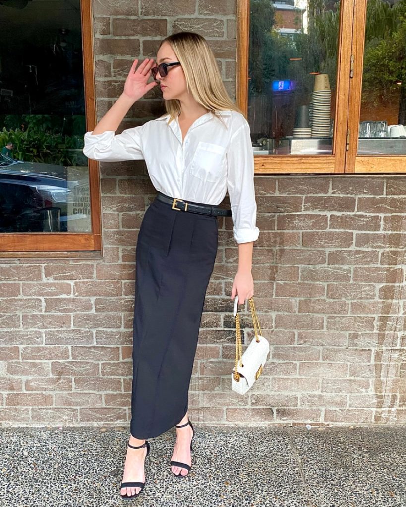 woman wearing black long skirt and white shirt