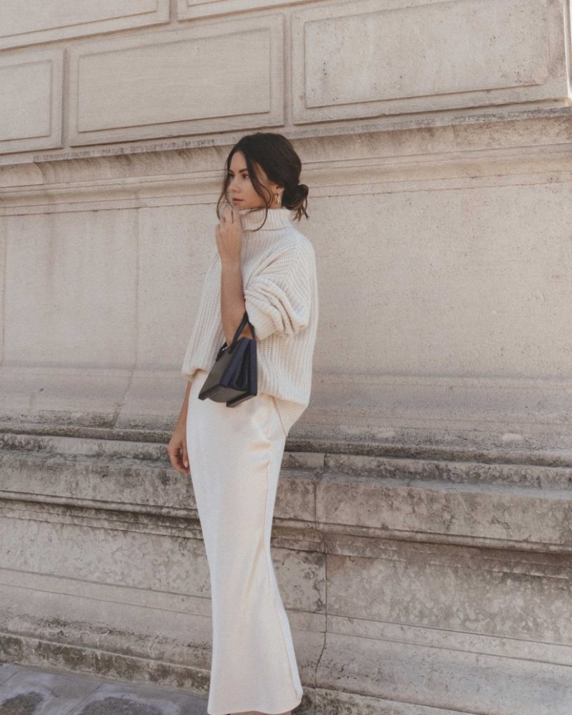 woman wearing white satin skirt with white top