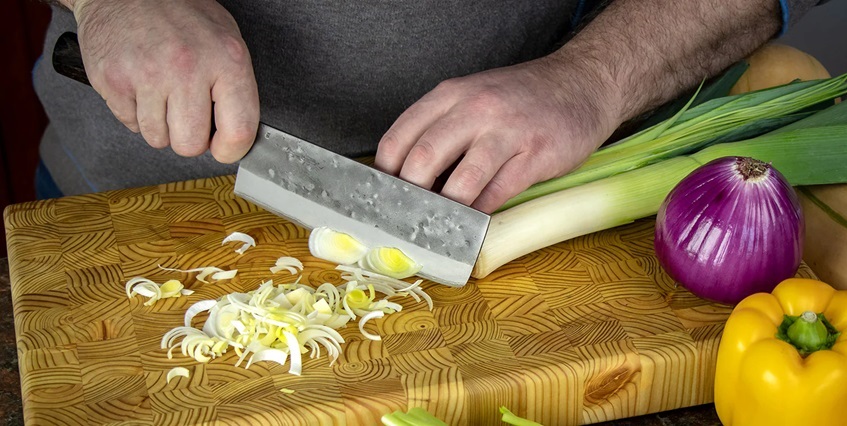 person using nakiri knife 