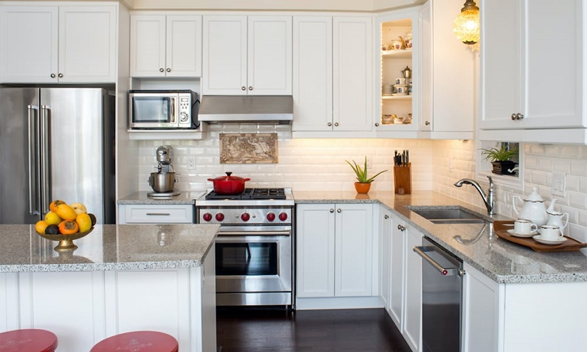 kitchen in white colour with the right kitchen appliances