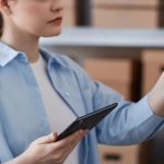 woman holding wireless barcode scanners