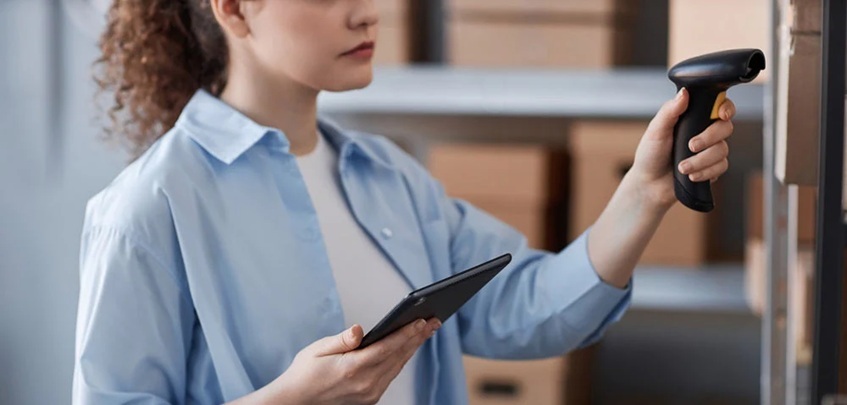 woman holding wireless barcode scanners