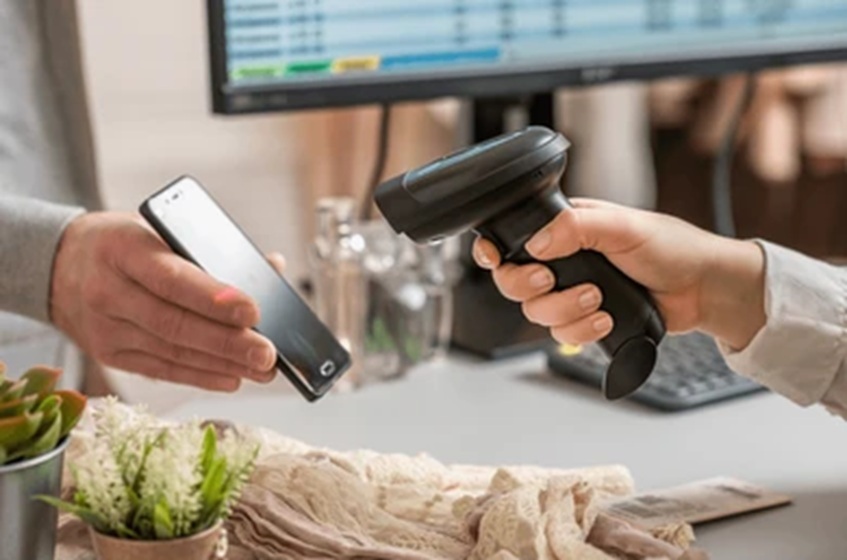 person using wireless barcode scanner