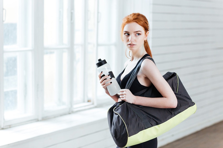 woman wearing dance bag